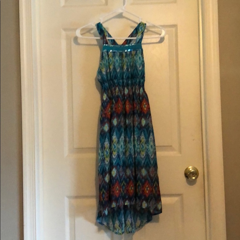 A blue dress with colorful designs